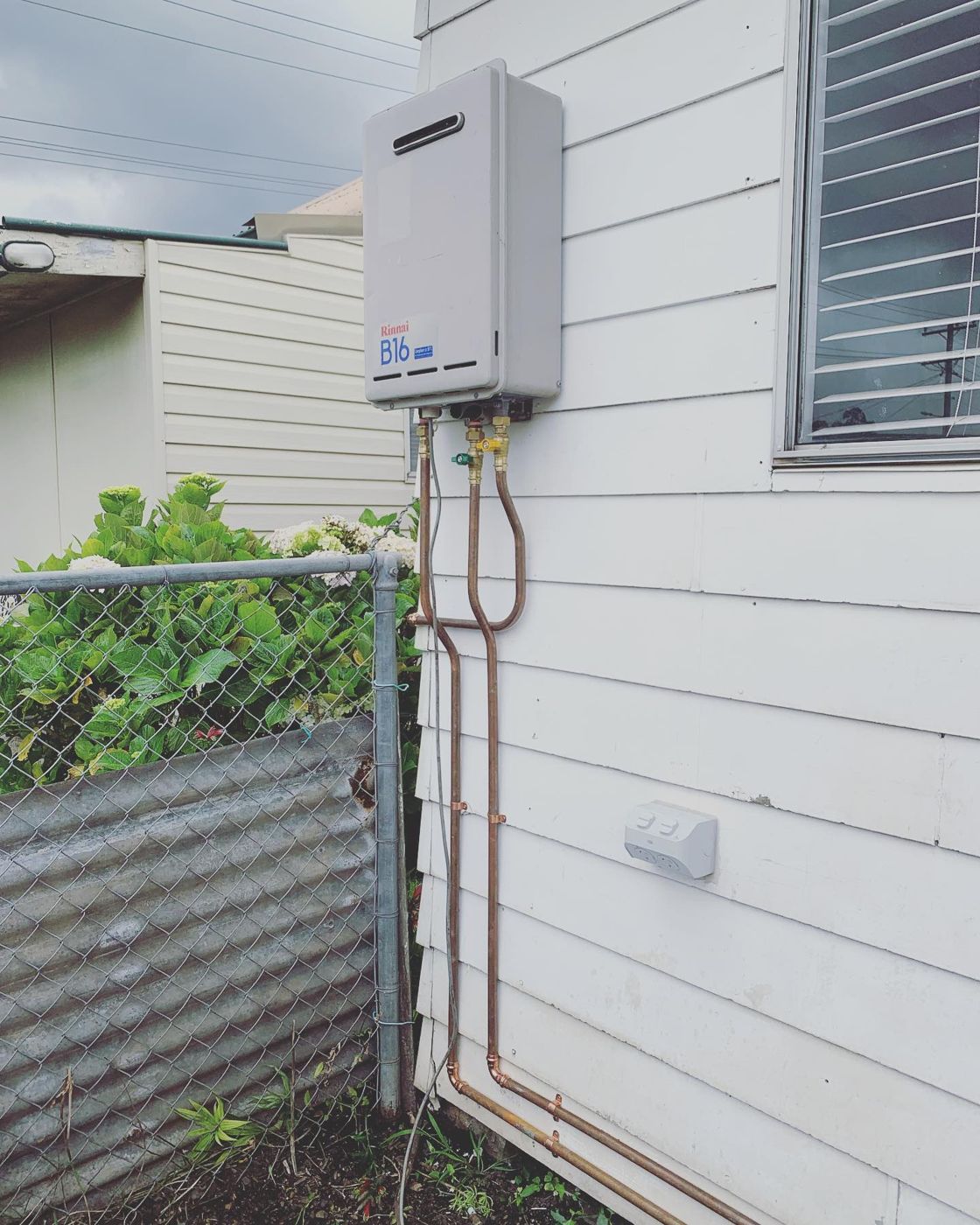 Relocated instantaneous hot water after